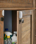 SmartThings Multipurpose Door And Window Sensor With Temperature Monitoring And Zigbee Connectivity on wooden cabinet door