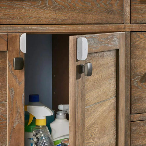 SmartThings Multipurpose Door And Window Sensor With Temperature Monitoring And Zigbee Connectivity on wooden cabinet door
