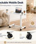 Smooth Operator Mobile Rolling Desk With Lockable Casters And Pneumatic Height Adjustment From Twenty Eight To Forty One Inches, white desk with lockable casters and laptop.