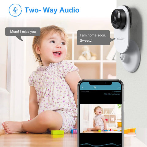 Mini Smart Home Camera 1080P 2.4G WiFi Security Cam With Ultra Wide 120 Degree Lens showing two-way audio feature with child.