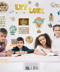 Travel The Map Bulletin Board Set For Classrooms 27 Piece Travel Cutouts With motivational sayings above children in classroom.