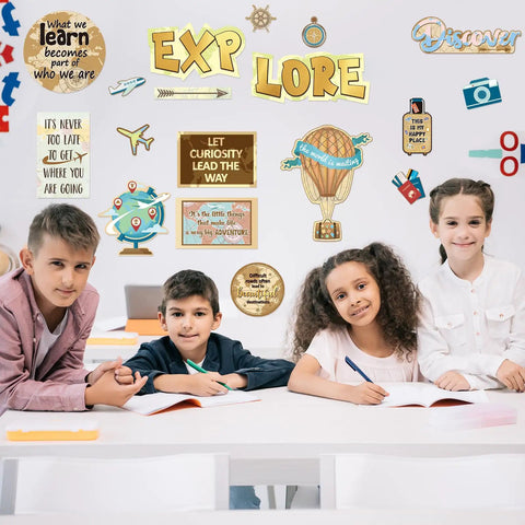 Travel The Map Bulletin Board Set For Classrooms 27 Piece Travel Cutouts With motivational sayings above children in classroom.