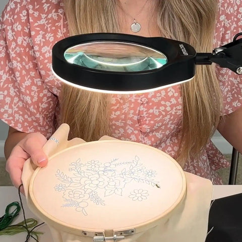 Person using 10X Magnifying Desk Lamp With 96 LEDs, 5 Inch Real Glass Lens for detailed embroidery work