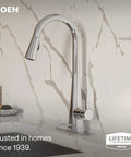 Moen Swyre Pulldown Kitchen Faucet, Chrome, 87508EW with sleek curved neck and single-handle lever mounted on a marble countertop.