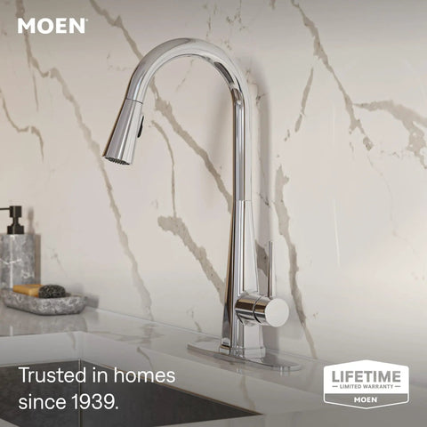 Moen Swyre Pulldown Kitchen Faucet, Chrome, 87508EW with sleek curved neck and single-handle lever mounted on a marble countertop.