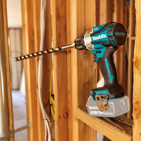18V LXT Brushless Cordless Hammer Drill And Impact Driver 2 Piece Combo Kit With 5.0Ah Batteries shown in wooden framing