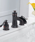 Widespread 8 Inch Two Handle Bathroom Faucet With Pop Up Drain Assembly Waterfall Style Oil Rubbed Bronze Finish in use