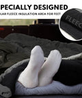 Close-up of feet in a grey XXL Winter Sleeping Bag For Adults And Kids, 4 Season Cold Weather Camping Gear, showing fleece insulation area.