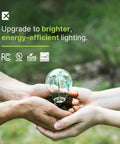 Hands holding a small plant under a glass bulb with energy-efficiency icons, promoting Compact CFL Light Bulbs T2 Spiral 23W 1520 Lumens Daylight 5000K E26 Base UL Listed 120V 8 Pack Instant On Flicker Free Long Lasting Low Heat For Desk Or Table Lamps