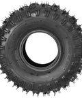Close-up of a single 4.10-4 tire and inner tube replacement set for utility carts and small tractors, showing tread and sidewall details.
