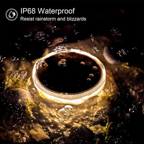 Solar Deck Lights Outdoor Waterproof LED 4 Pack glowing in rain, highlighting IP68 waterproof feature with warm white light.