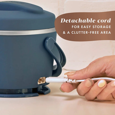 Hand detaching cord from Portable 20-Ounce Electric Food Warmer Personal Lunch Box Keeps Food Spill-Free And Warm Ideal For Travel Work School