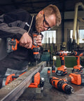 Professional Heavy Duty Compact Four Speed Cordless Drill With Brushless Motor All Metal Transmission QuickIN Adapter And Rugged Case in use on metal.