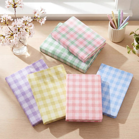 Six Pack Stretchy Book Covers For Hardcover And Paperback Up To 9 By 11 Inches With Aesthetic Floral And Gingham Patterns Reusable Protective Sleeves With Bookmarks To Keep Your Books Clean Protected And Ready To Read on table