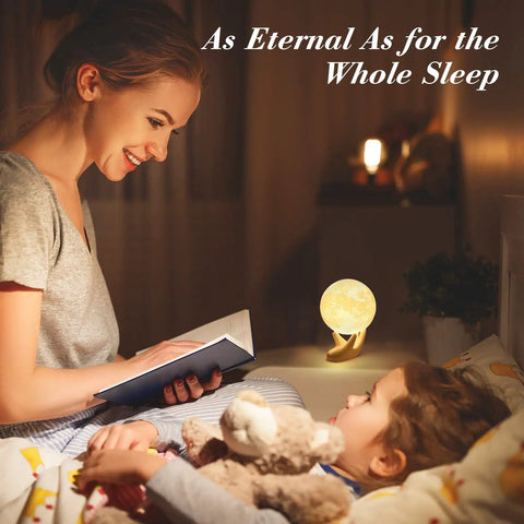 Mother reading to child with 3.5 Inch 3D Moon Lamp With Ceramic Base Touch Dimmable LED Night Light in background.