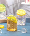 20 Pack 100 mL Glass Beaker Set Heavy Duty Lab Beakers With Printed Graduation showcasing drinks and citrus slices