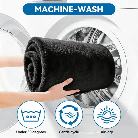 Hand placing black Waterproof Towel Car Seat Cover Sweat-Wicking Front Seat Protector into washing machine, symbols for wash instructions visible.