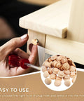 Hand applying 200 Pieces Wood Screw Hole Plugs Three Eighths Inch Mushroom Caps For Furniture Repair And D I Y Projects Natural Wood Button Plugs To Hide Holes Hardwood Wood Caps For Cabinets And Tables No Mess Quick Fix