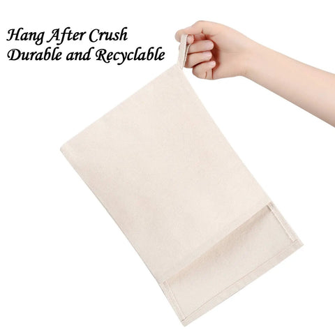 Heavy Duty Canvas Lewis Ice Crushing Bags 2 Pack Bartender Gear with Tight Seal Flap held by hand.