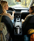 Two women in a car with a Portable 12V And 24V Car Kettle With Leakproof Stainless Steel Interior ready for road trip drinks.