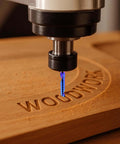 CNC router bit with 1/4 inch shank, blue spiral single-flute end mill cutting wood.