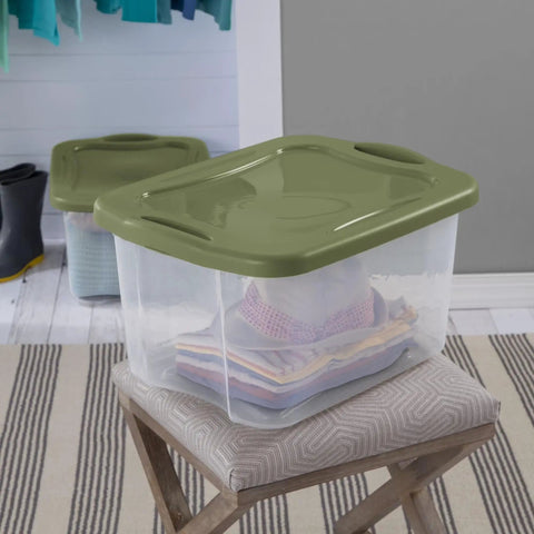 Heavy Duty 2 Pack 40 Quart Clear Plastic Storage Bins Stackable Totes With Secure Snap Lids And Grip Carry Handles on a chair.