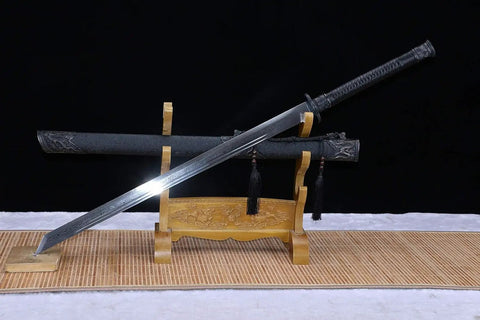 Beefy Damascus Tang Dao Sword With Black Gold Finish displayed on a stand, featuring a full tang and traditional folding pattern.