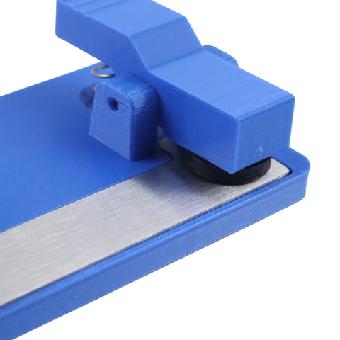 Close-up view of Super Grippy LED Strip Soldering Jig Helper Dual Clamp PCB Hold Down Tool with blue plastic and stainless steel base.