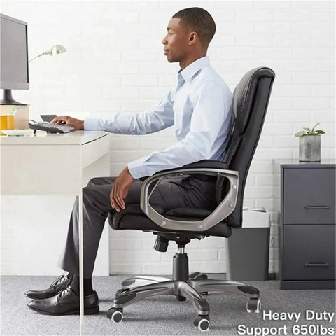 Man using a chair with Easy Click Swap 2 Inch Silent Caster Wheels For Office And Gaming Chairs Heavy Duty Soft Rubber Tires.