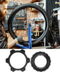 Mechanic working on bike with Beefy Center Lock Bike Rotor Tool For Upgrading Your Ride With Durable Aluminum Adapters.