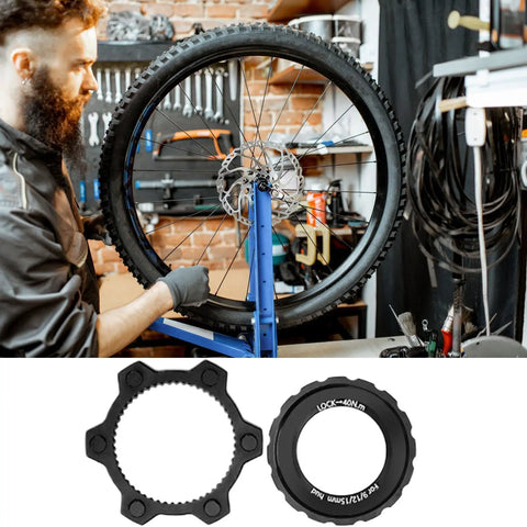 Mechanic working on bike with Beefy Center Lock Bike Rotor Tool For Upgrading Your Ride With Durable Aluminum Adapters.