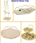 Geometric brass trays and stands with jewelry, showcasing usage for organizing rings and bracelets.