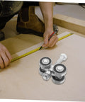 Top Shelf Stainless Steel Sliding Door Wheels Replacement Kit Featuring Dual Bearing Pulleys on workspace surface with measuring tape.
