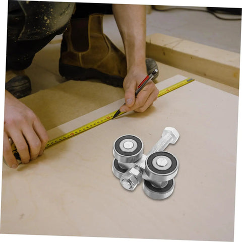 Top Shelf Stainless Steel Sliding Door Wheels Replacement Kit Featuring Dual Bearing Pulleys on workspace surface with measuring tape.