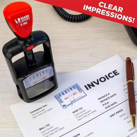 Self Inking Date Stamp With Received Phrase on paperwork, compact design on desk showing smooth twist mechanics for easy use.