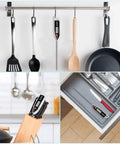 Meat Thermometer Digital Instant Read Thermometer For BBQ Grill Oil Milk Candy Bath Water Deep Fry Candle Temperature Kitchen Cookin Tool With Large Display And 10 Minute Auto Shut Off hanging among kitchen utensils.