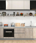 Modern kitchen with built-in appliances, decorative items on shelves, and wood cabinets.