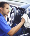 Person using Pack Of 50 Reusable Cotton Rags For Home Garage And Car Detailing Durable Soft 13 By 13 Inch White Towels in car