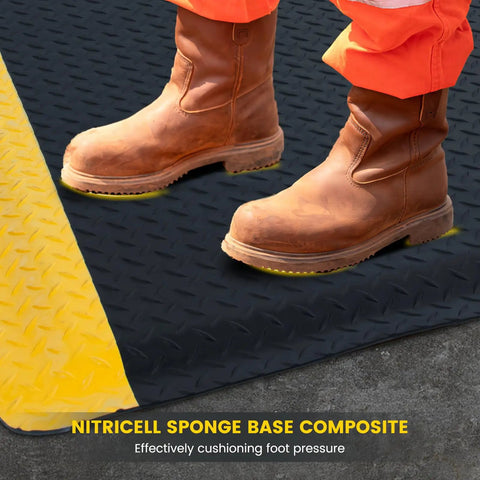 Worker standing on ESD Anti Fatigue Conductive Floor Mat Three By Twelve Foot Heavy Duty Diamond Plate With Soft Cushioned Sponge Non Slip