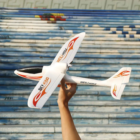 Hand holding Sky King inspired fighter glider, Three Channel RC Airplane for Adults And Beginners, Ready To Fly