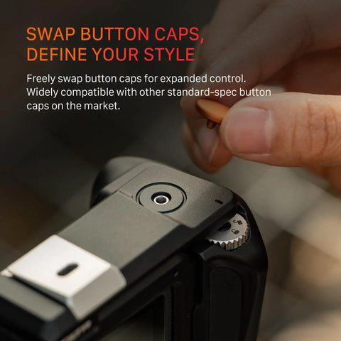 Close-up of customizable button cap on DJI Osmo Action 6 Street Snap Kit Camera Cage With Quick Release Hand Grip Built In Battery Storage Locking Dial And Swappable Button Caps For Customization Black.