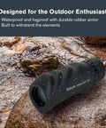 Nature 10x25 Monocular For Hiking And Wildlife Viewing Lightweight Travel Ready Tool For Birding On The Go With 10x Magnification And Bright 25mm Lens Built For Outdoor Adventures And Clear Distant Details, waterproof black monocular on rock by stream