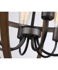 Close-up of Six-Light Orb Chandelier with E26 sockets in Stardust finish, showcasing rustic metal arms and Edison-style bulbs.