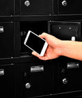 Real Tough Twenty Four Door Cell Phone And Tablet Locker Cabinet With Individual Key Compartments Heavy Duty Steel Build No Fuss Setup locks a smartphone in a locker.