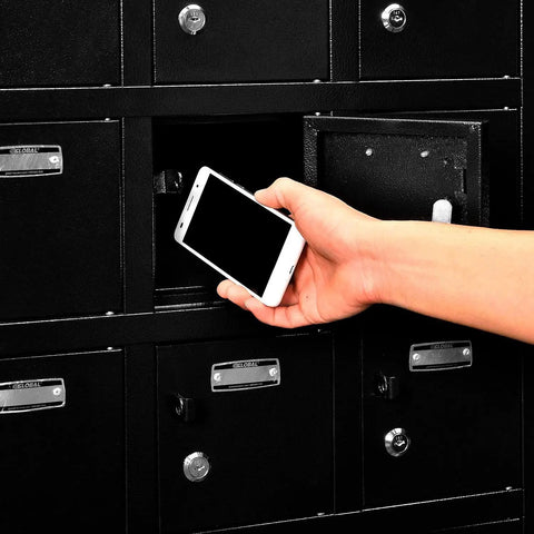 Real Tough Twenty Four Door Cell Phone And Tablet Locker Cabinet With Individual Key Compartments Heavy Duty Steel Build No Fuss Setup locks a smartphone in a locker.