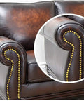Killer One Inch Gold Antique Upholstery Tacks Pack Of Thirty showcased on a brown leather sofa arm for furniture restoration.
