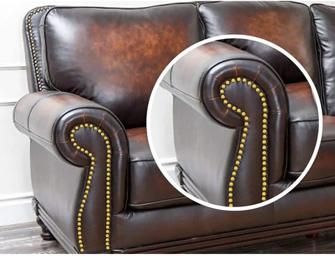 Killer One Inch Gold Antique Upholstery Tacks Pack Of Thirty showcased on a brown leather sofa arm for furniture restoration.