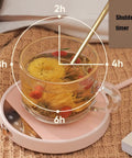 Smart Electric Coffee Mug Warmer Triple Temperature Settings Digital Display with flower tea and shutdown timer on a pink base.