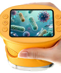 Hand holding 1000X Handheld Digital Microscope For Kids Pocket Microscope With 2 Inch IPS Screen showing bacteria on display