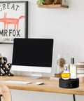 6 Piece Black Turner Cup Rotating Display Stand With USB Power Cable And Silent Motor Battery Backup For Kitchen Tumbler Organization on office desk.
